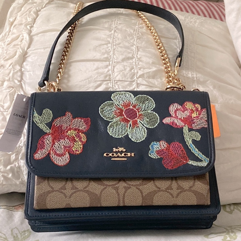 Gorgeous NWT COACH KLARE CROSSBODY in SIGNATURE CANVAS WITH FLORAL EMBROIDERY.